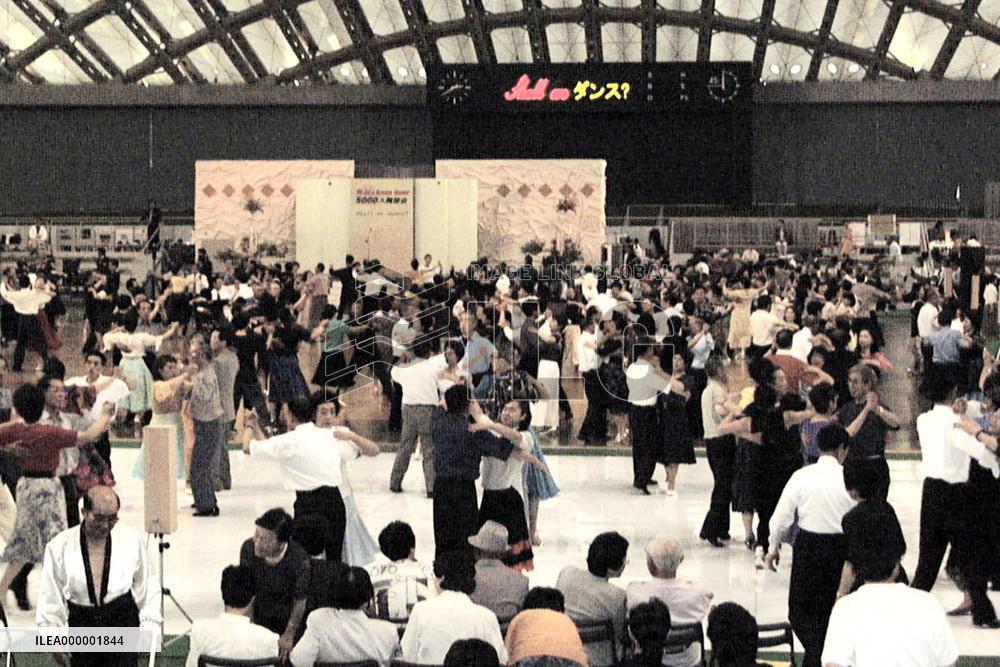 3,000 hold dance party in gym with wooden roof
