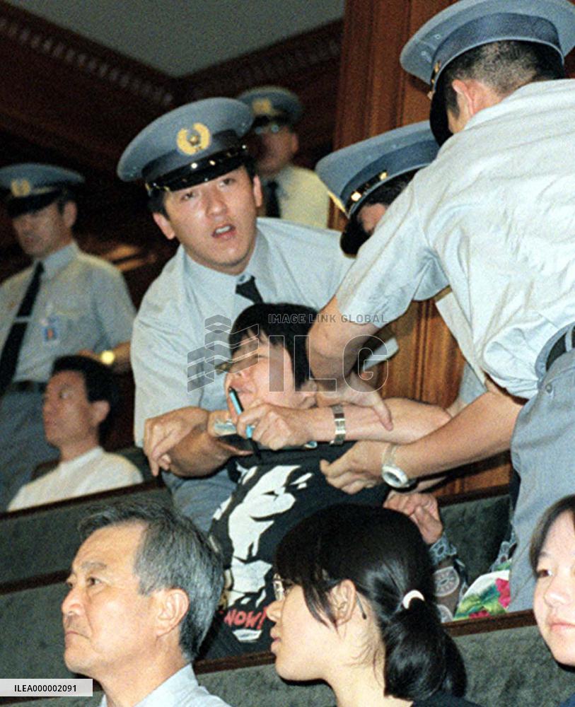 Diet guards subdue person against flag-anthem bill