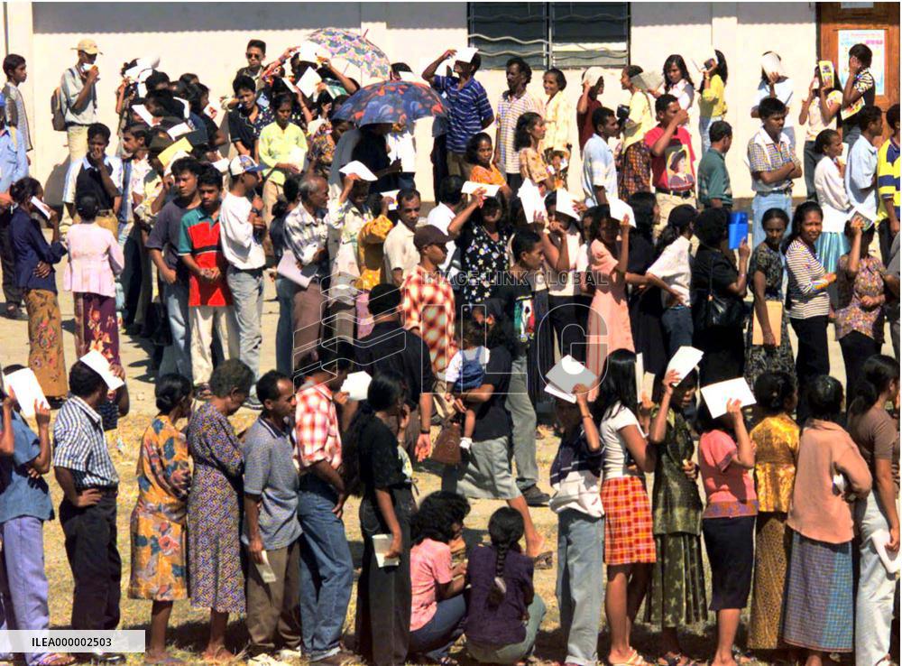 E. Timorese queue to vote for future territory