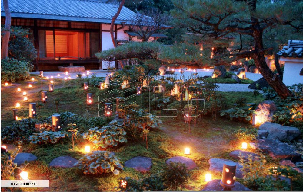 Kyoto temple garden lit up with candles