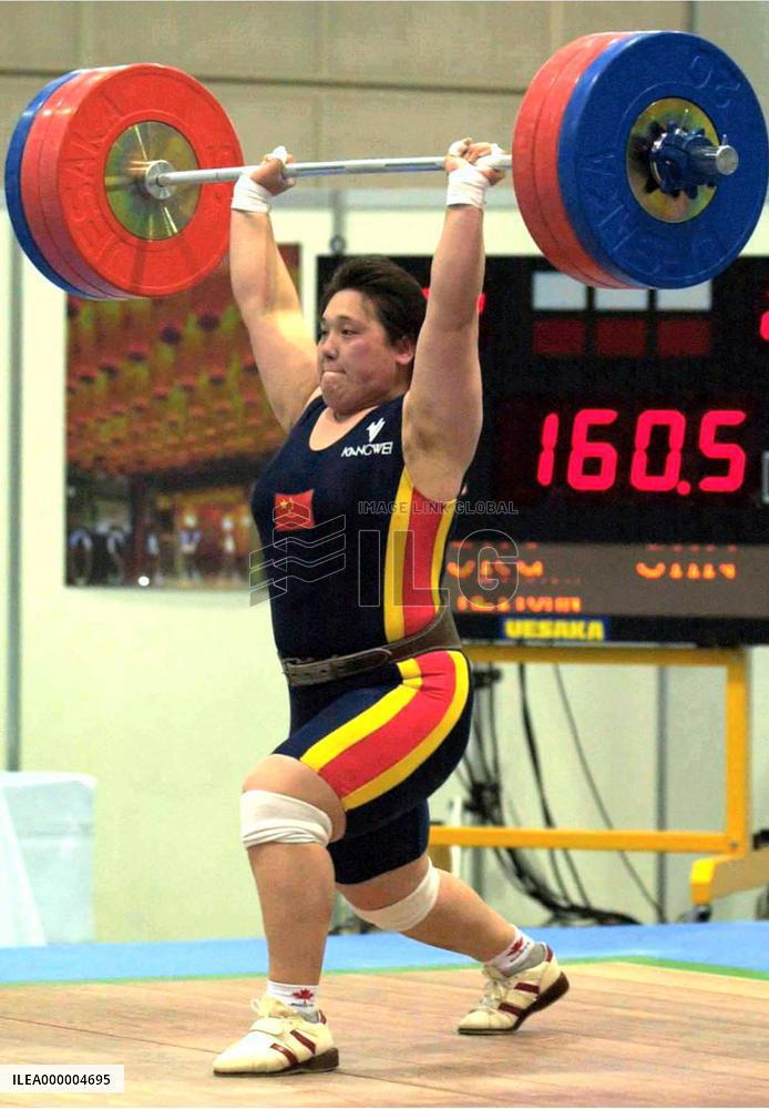 China's Ding gets over 75-kg title, sets world record