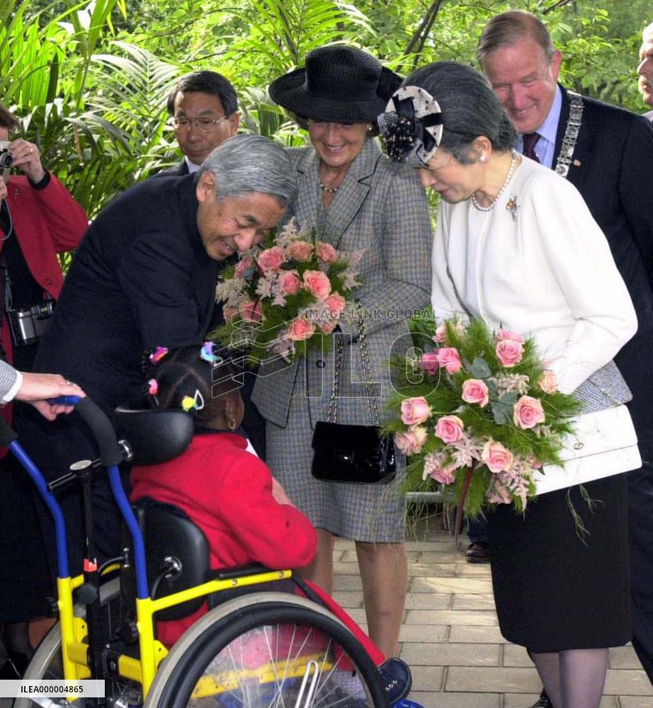 Emperor, empress meet handicapped children