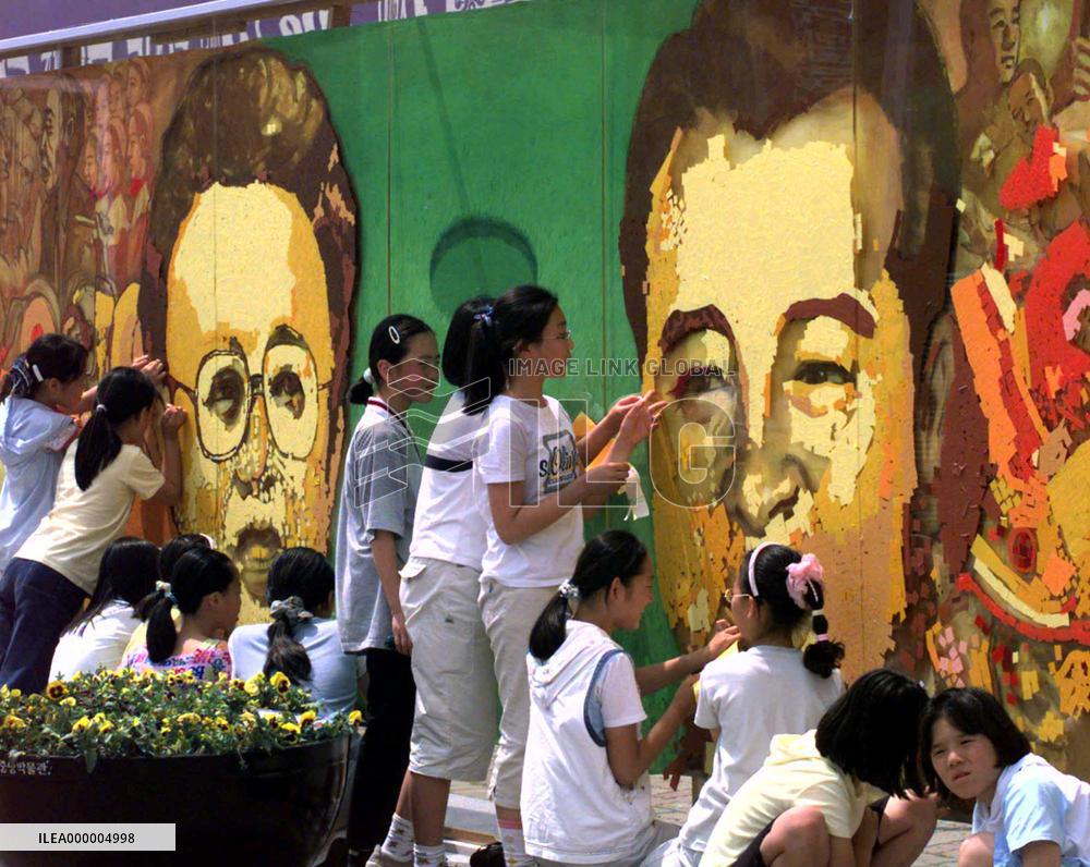 Portraits of North and South Korean leaders appear in Seoul