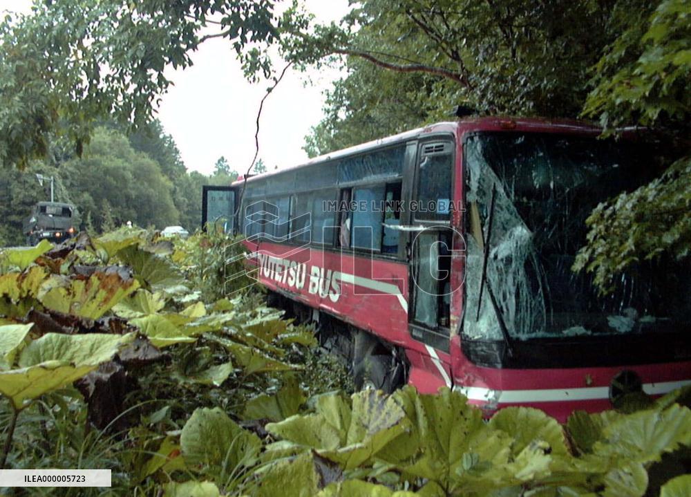 Sightseeing bus badly damaged in collision with military truck