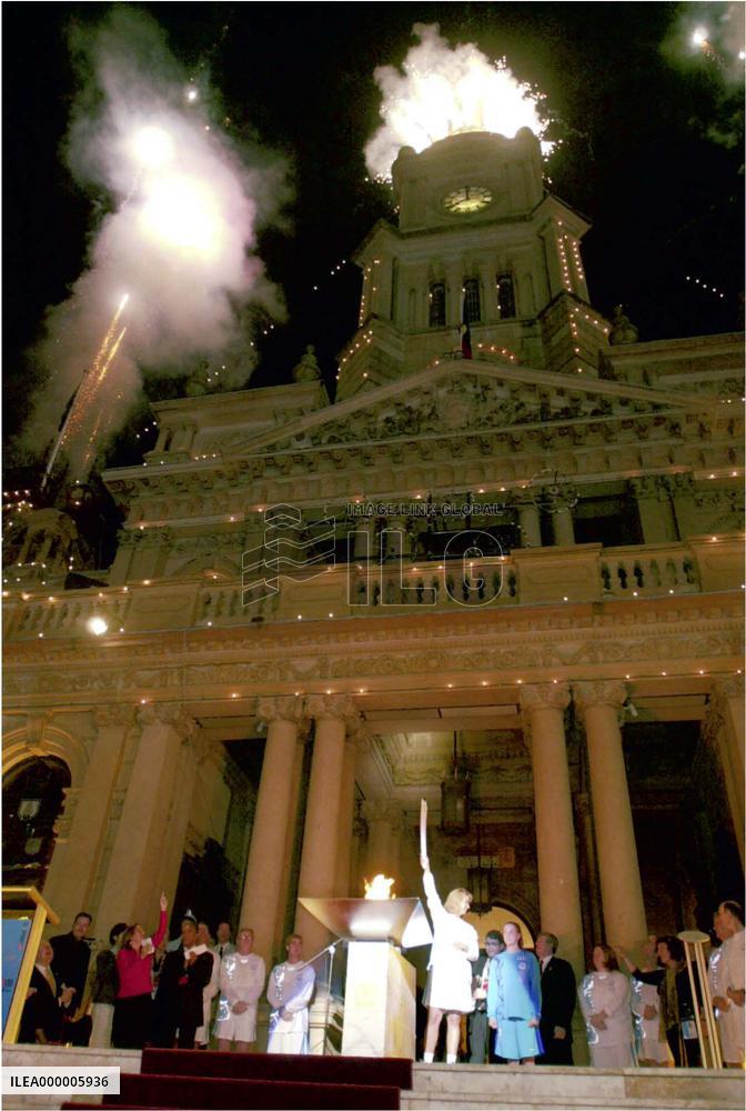 Olympic torch arrives in Sydney Town Hall amid fireworks display