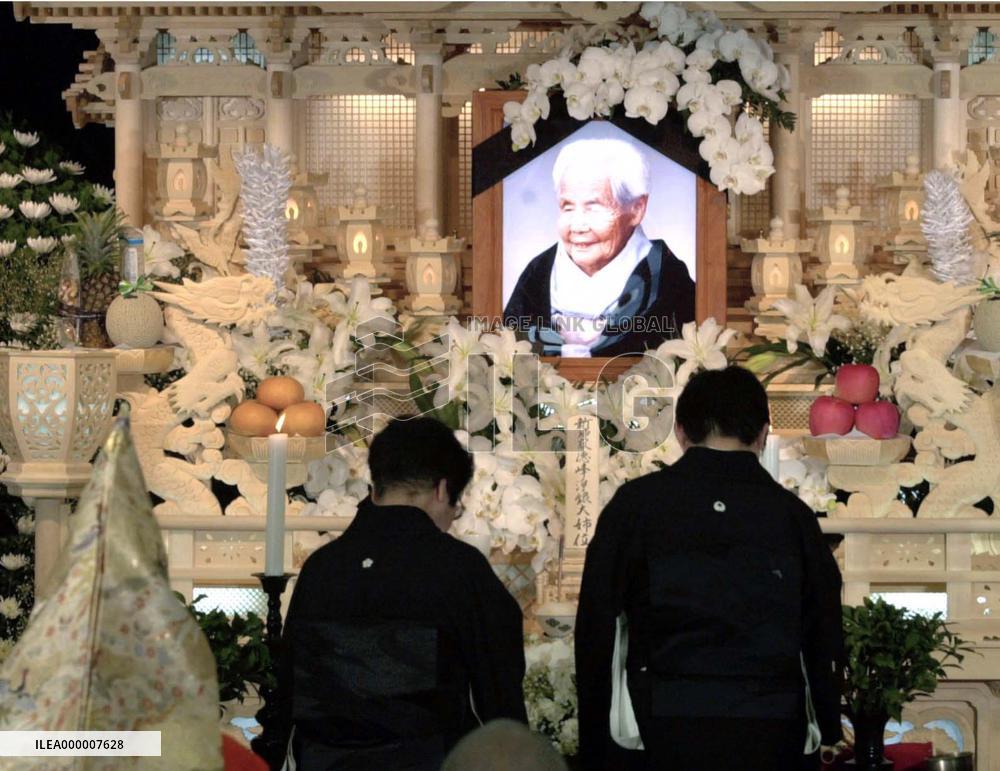 100 mourners pay respects to centenarian twin Gin-san