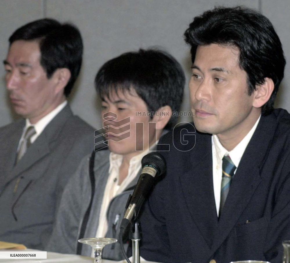 Relatives of sub collision victims meet reporters