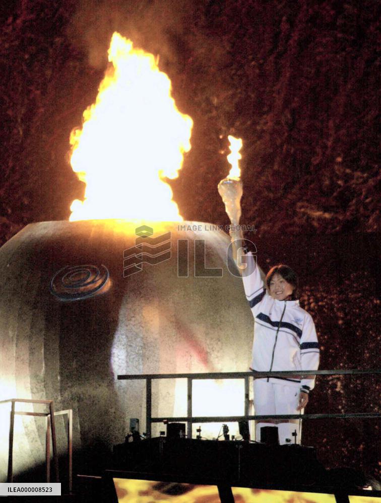 Takahashi lights 'Flame of Friendship' to open EAG