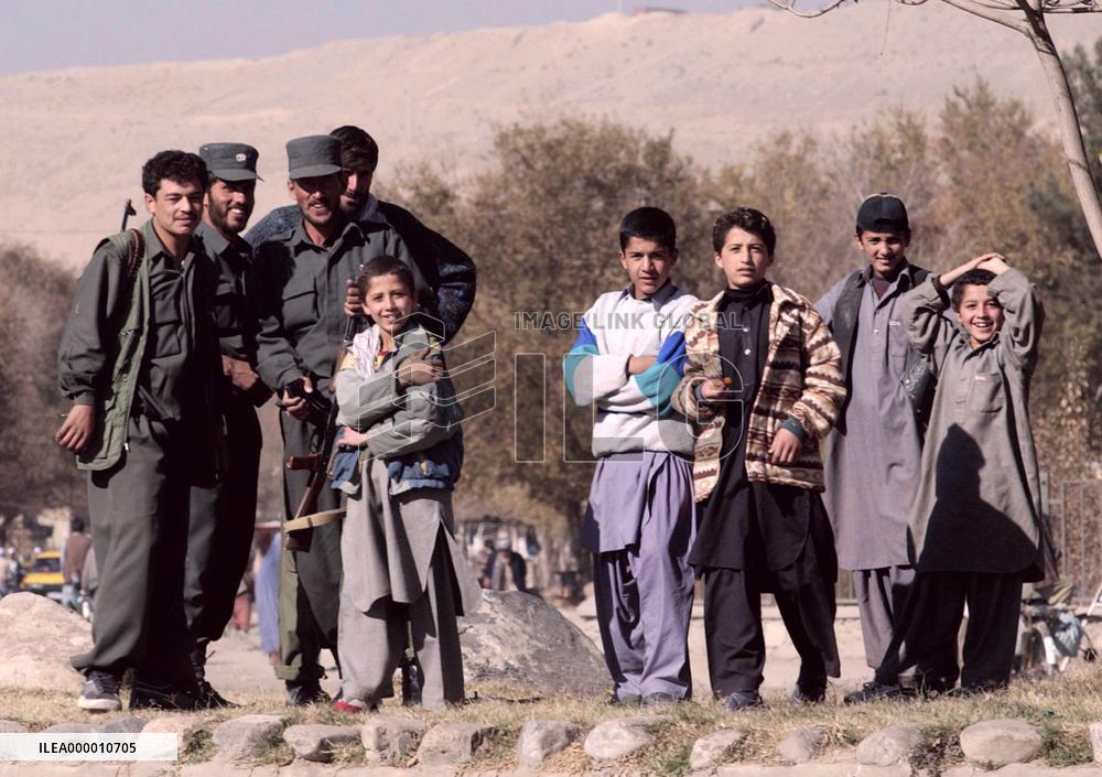 Boys and policemen in Kabul