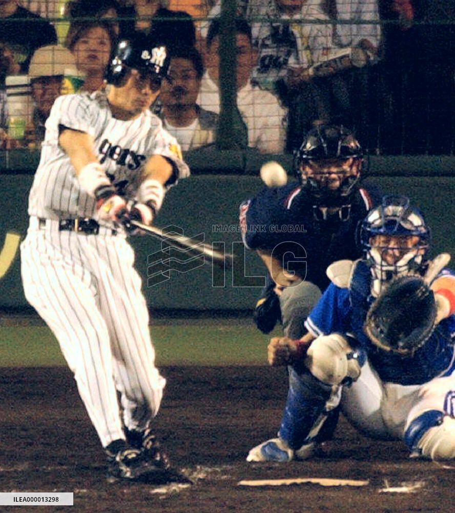 OSAKA, Japan - Hanshin Tigers infielder Shinjiro Hiyama hits an