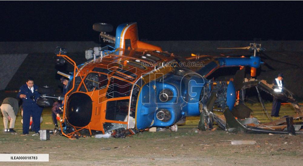 Wind knocks over helicopter, 1 dead, 2 injured