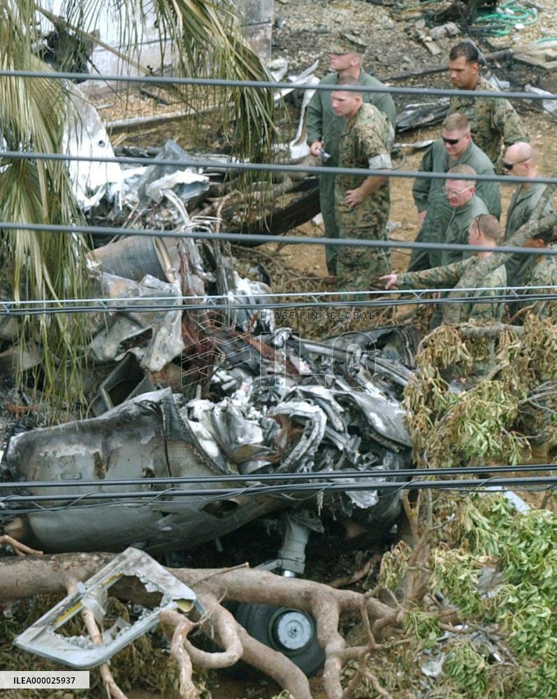 U.S. military officials investigate crash site