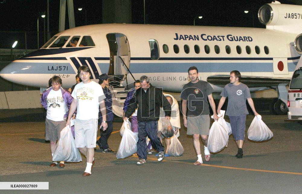 16 freighter crew members rescued, 6 missing