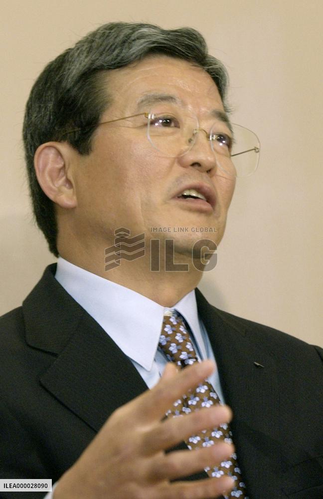 IBM to lower 2004 sales due to improper practice at Japan unit