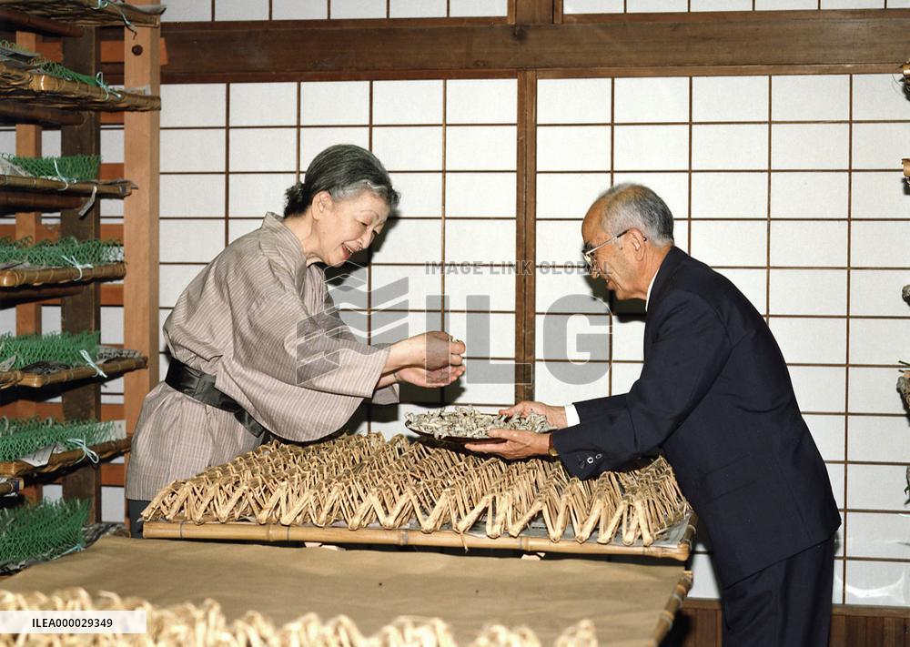 Empress Michiko helps silkworms produce cocoons