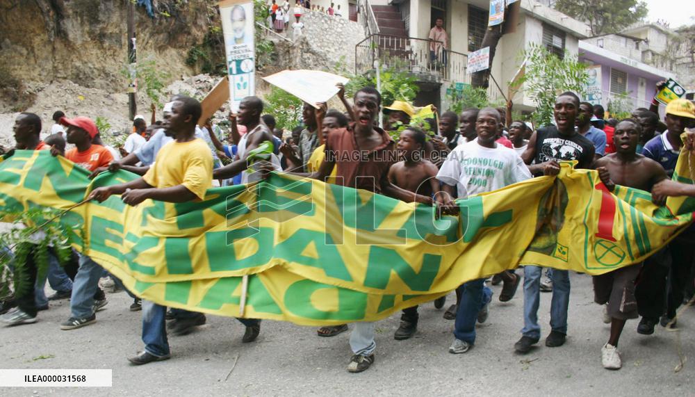 Supporters of Rene Preval march in Port-au-Prince