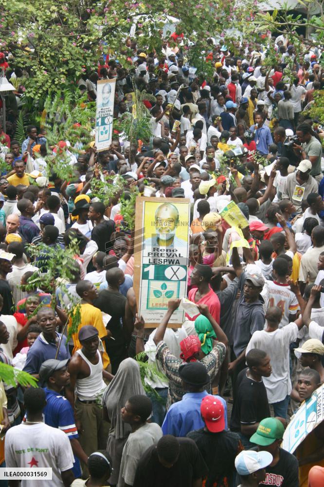 Supporters of Rene Preval march in Port-au-Prince