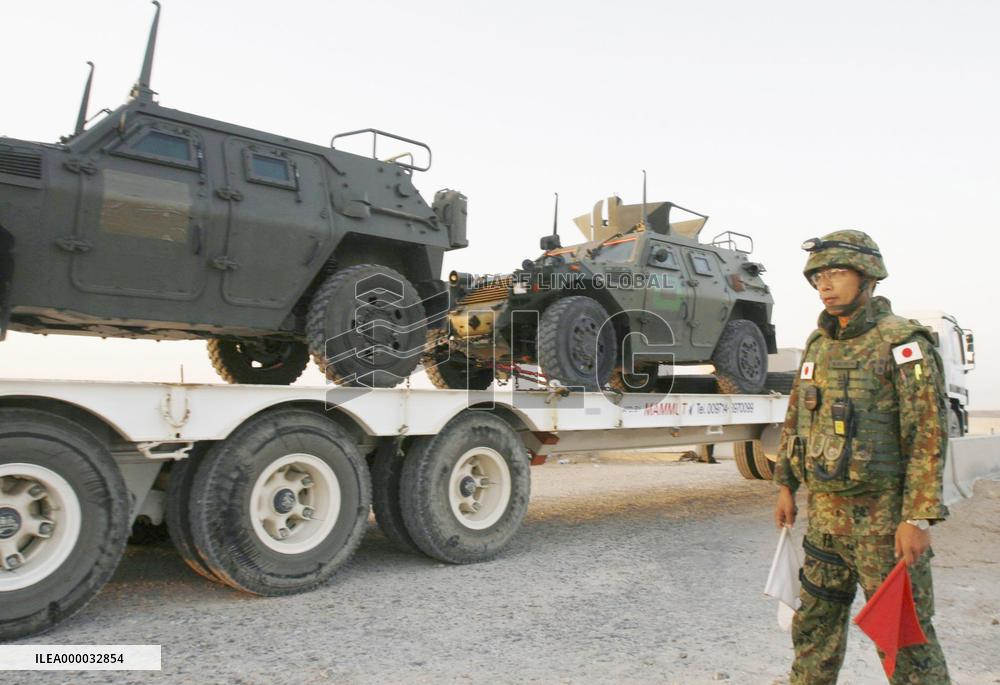 GSDF armored trucks leave Iraq's Samawah