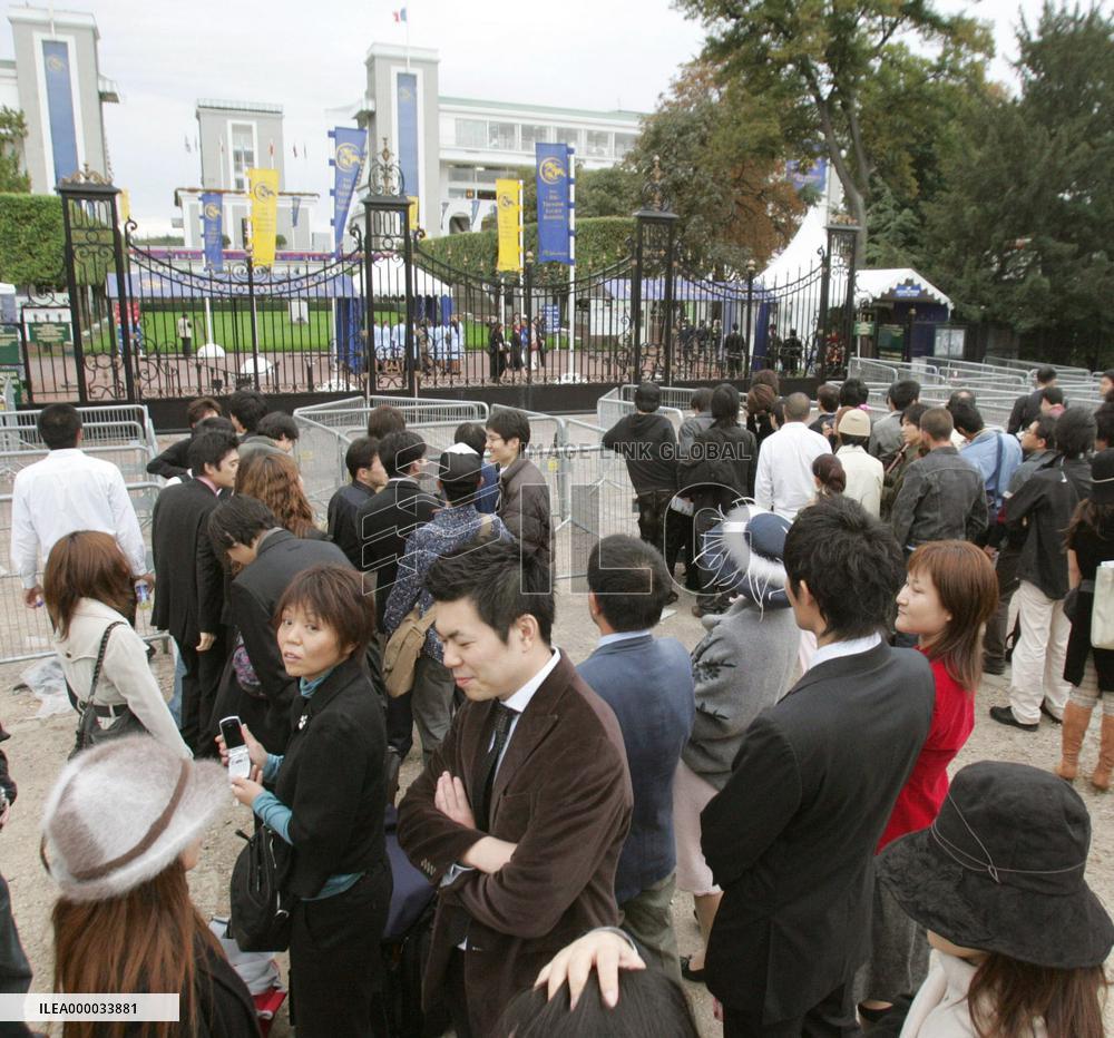 Japanese visitors at Longchamp racecourse