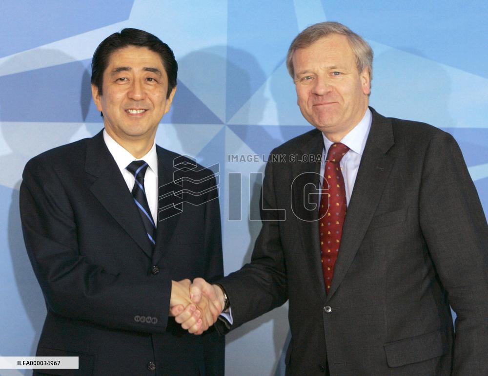 Abe tells NATO Japan won't shy from sending troops for int'l pea