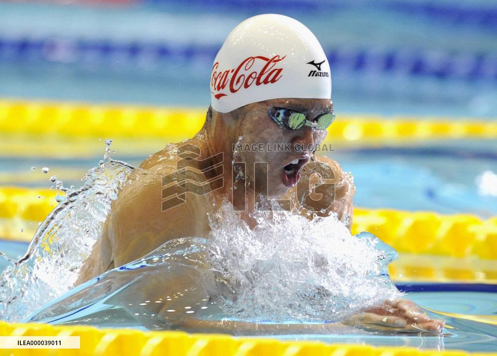 Kitajima eases to 100-meter win and Olympic berth