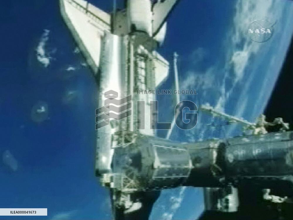 Wakata starts long stay at space station after Discovery dock