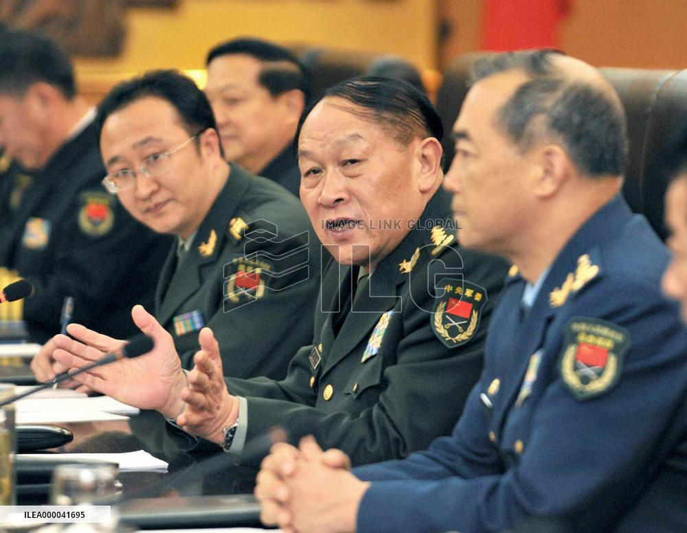 Japanese, Chinese defense chiefs hold talks in Beijing