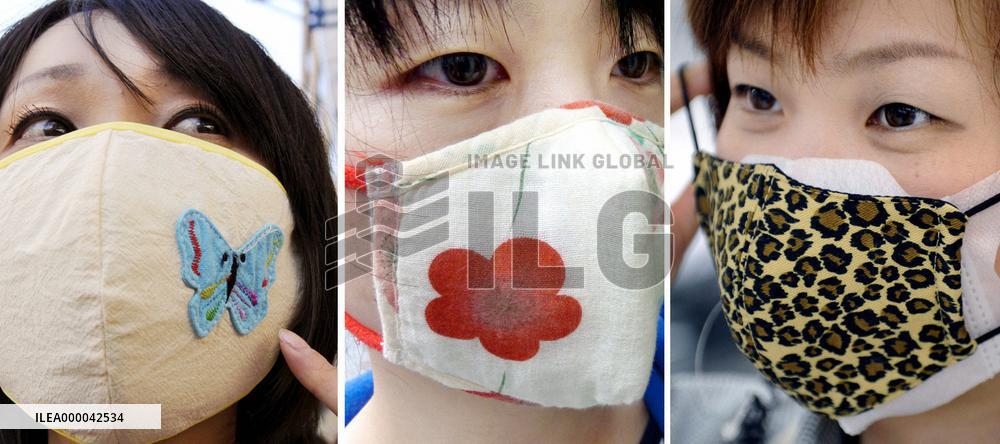 People wearing masks with unique designs amid spread of new flu