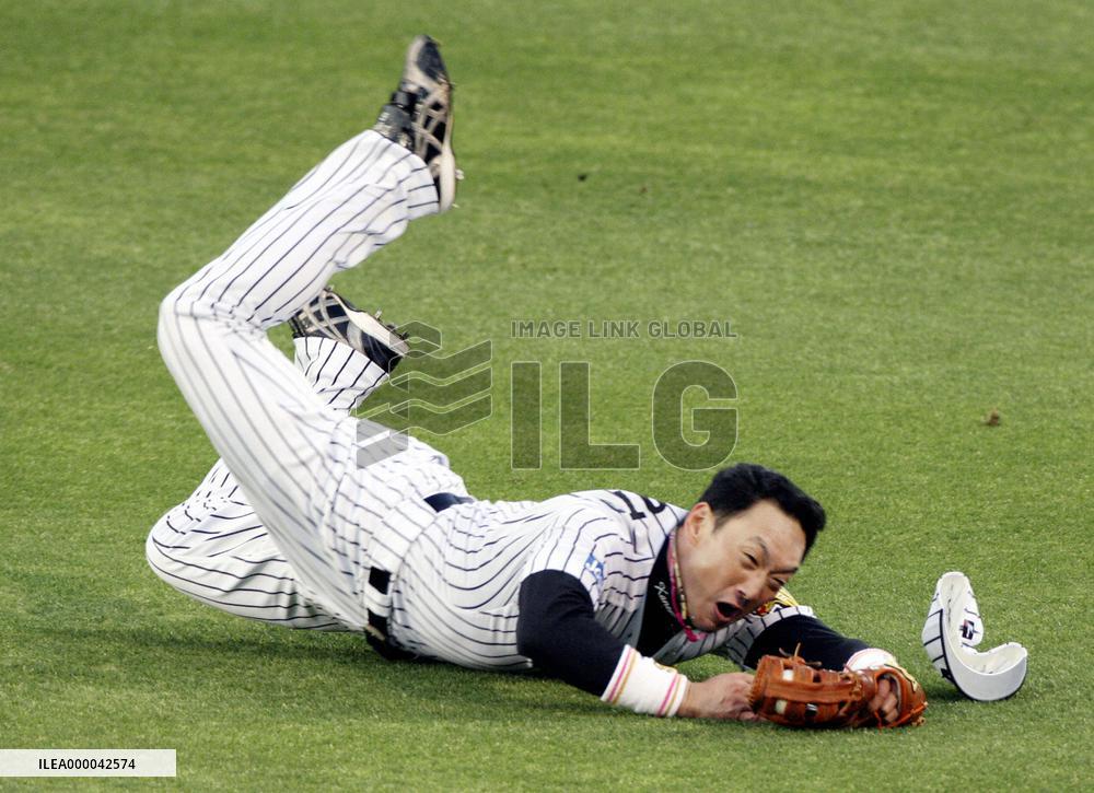 Hanshin's veteran Kanemoto leaps for ball