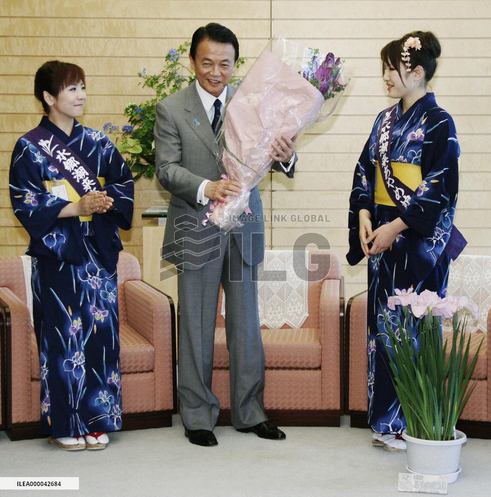 PM Aso receives courtesy call from 'iris' women