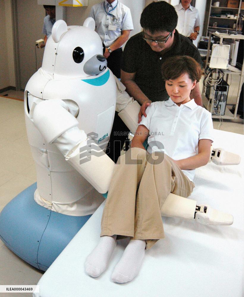 Tokai Rubber, Riken devise nursing-care robot to carry people