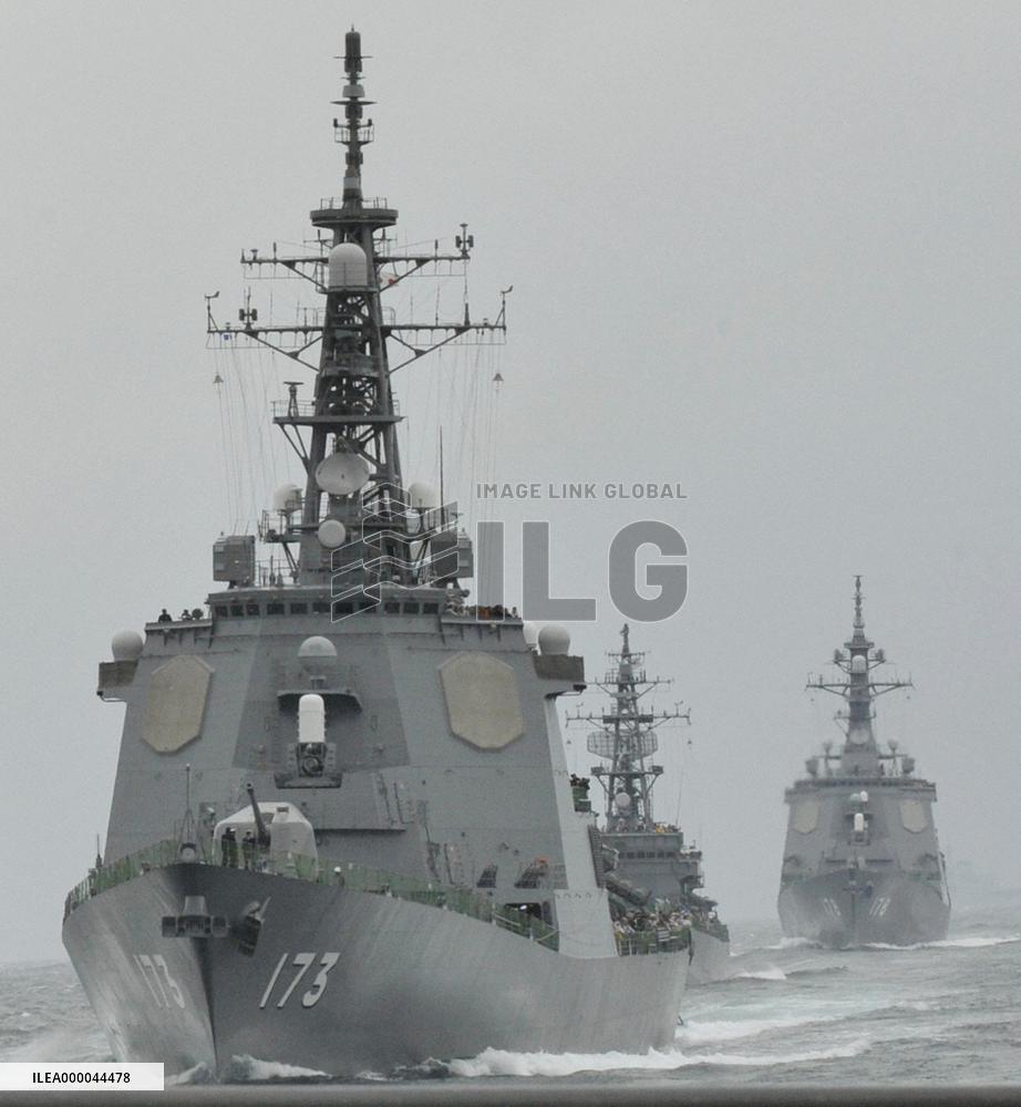 Japan destroyer test-fires missile at review