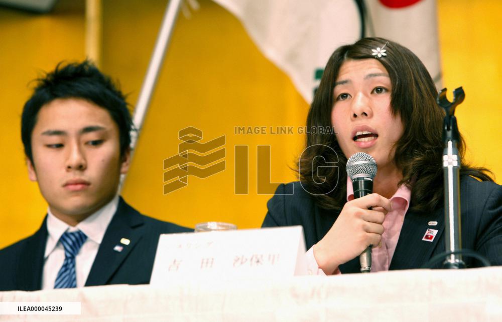 Olympic medalists protest budget cut plan