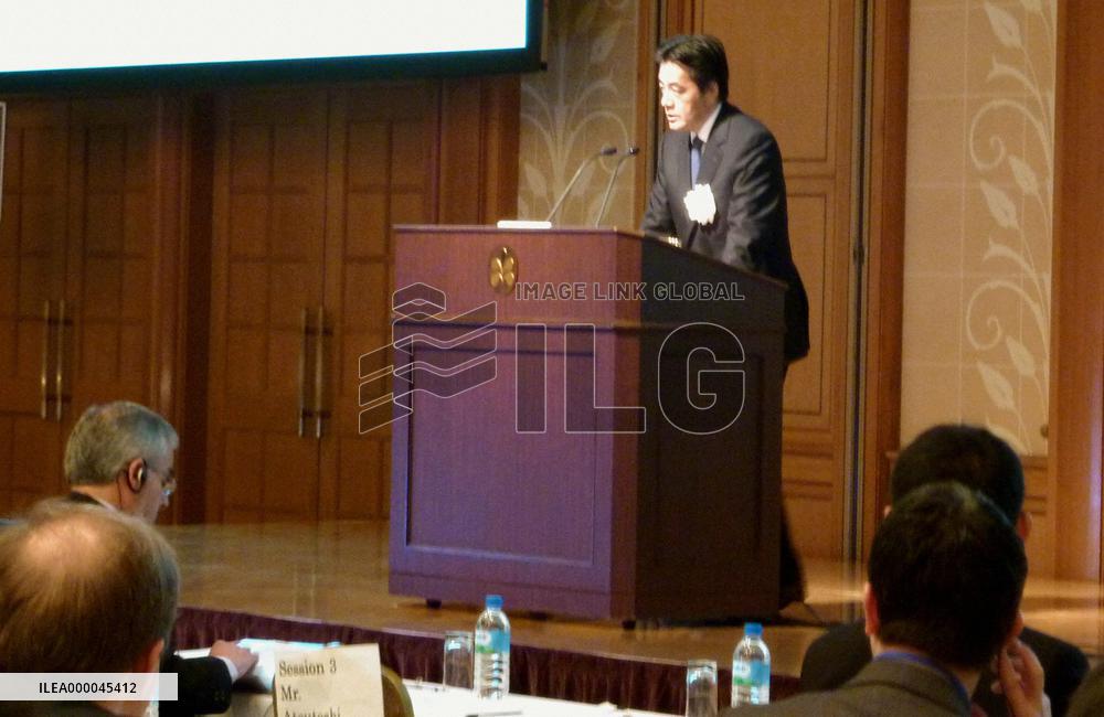 Okada speaks at APEC symposium