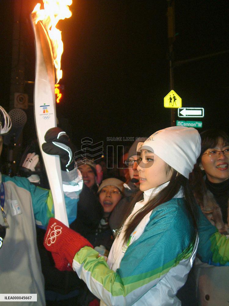 Figure skater Kim carries Olympic torch