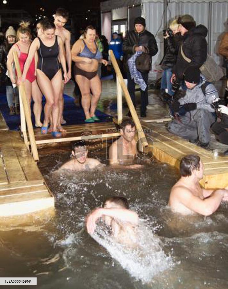 Orthodox Christians soak in icy water to mark Epiphany