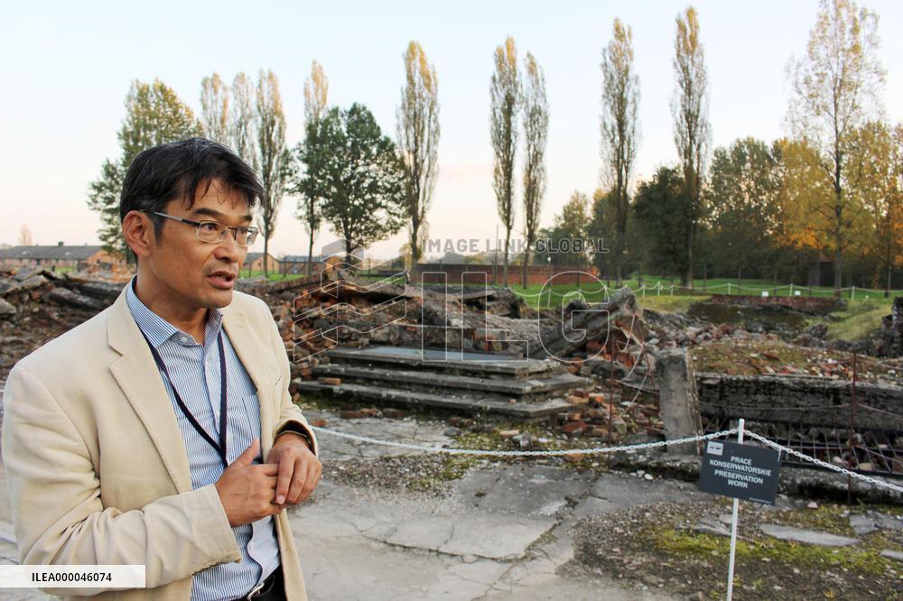 Japanese tour guide works at Auschwitz museum