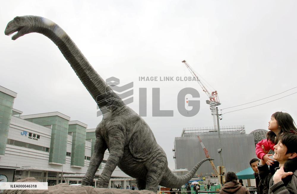 Dinosaur statue appears before railway station in Fukui, western Japan