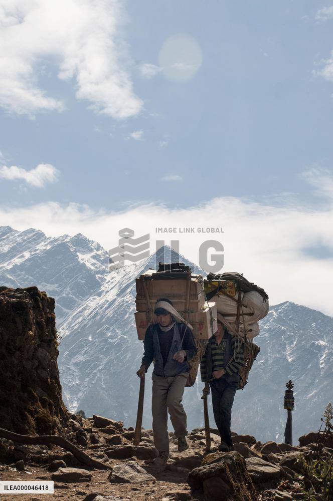 Porters on Everest Highway, tourist hotspot