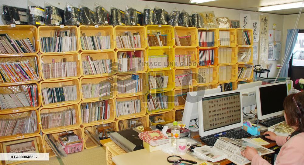 Numerous photos found in quake debris await owners in northern Japan