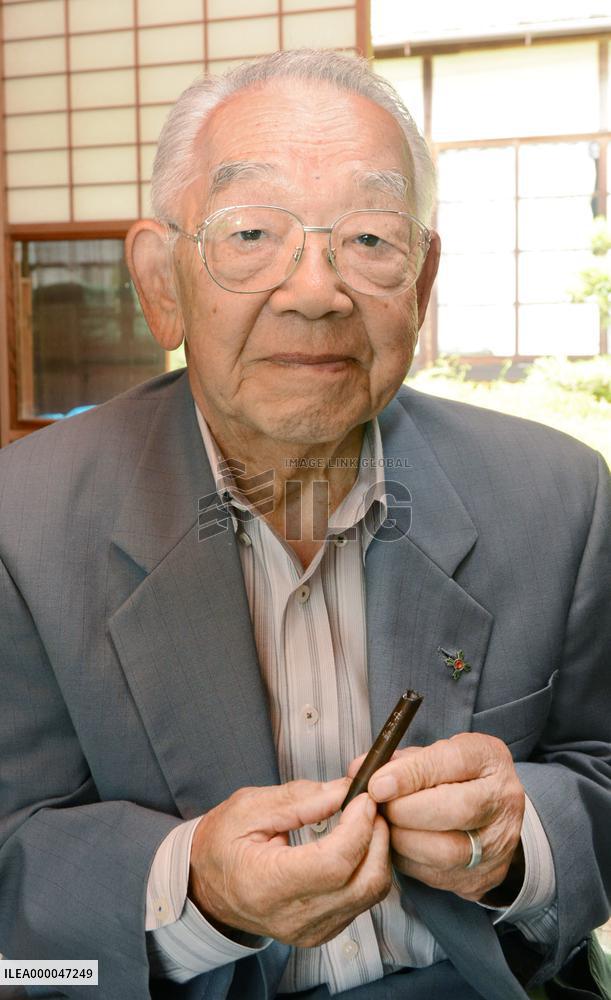 Kyoto man holds returned memento of brother killed in WWII