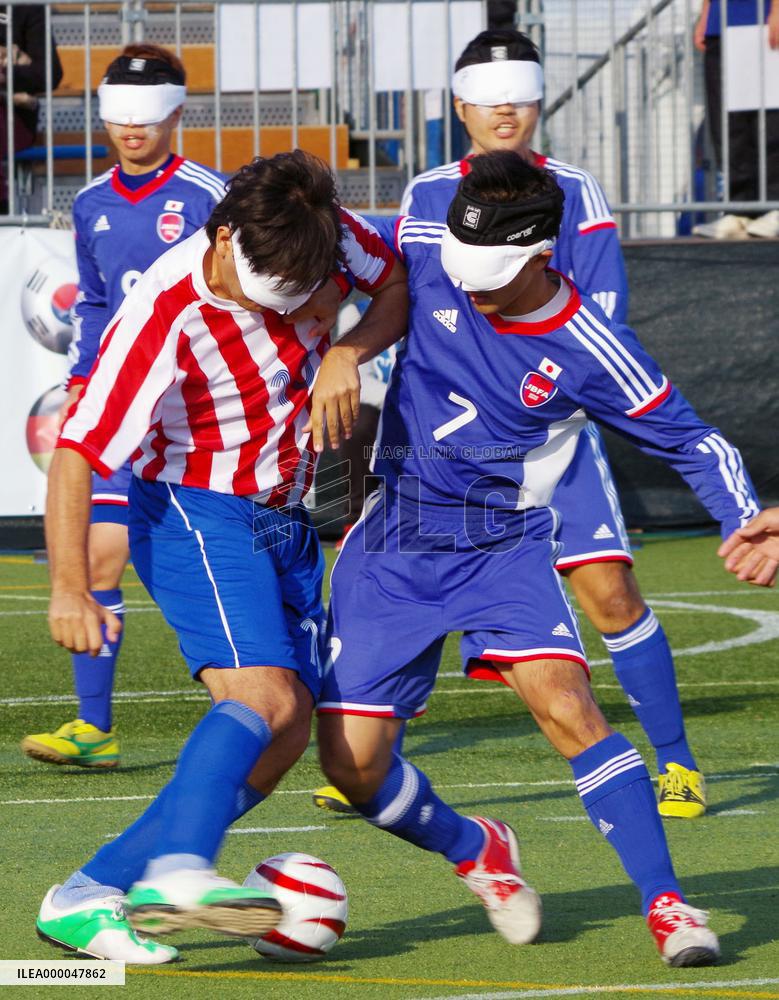 Blind footballer play at futsal courts in Tokyo
