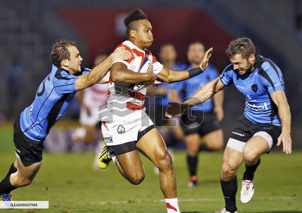 Japan center Matsushima in action in test rugby match vs. Uruguay