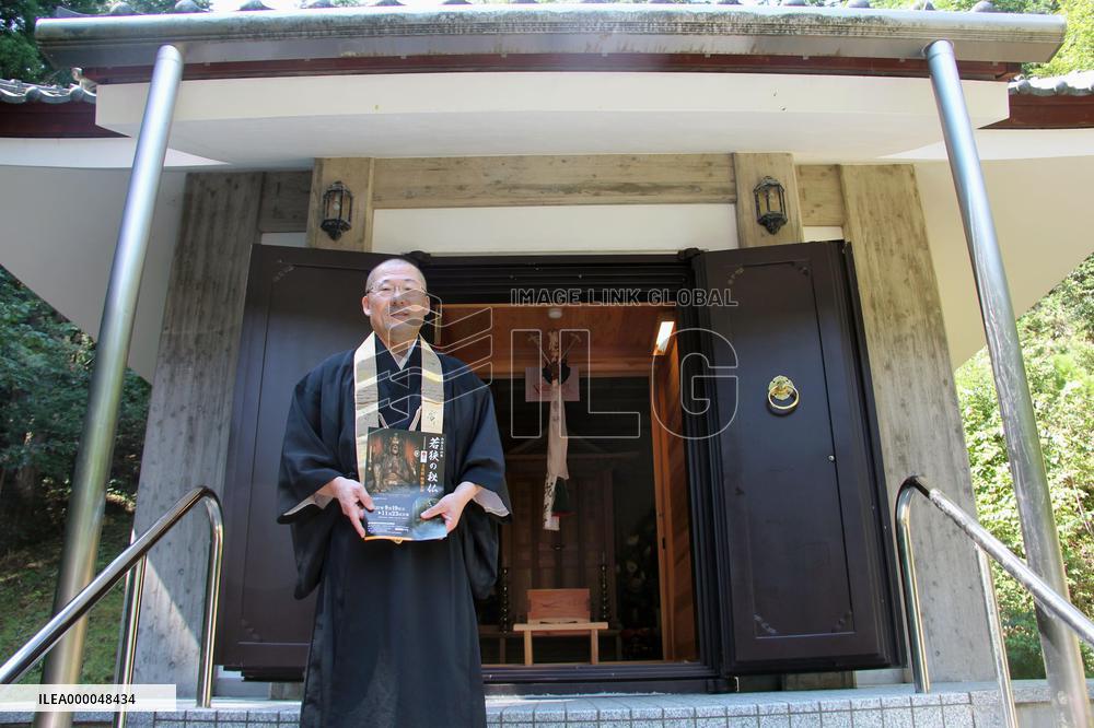 Priest of west Japan temple shows treasured Buddha statue
