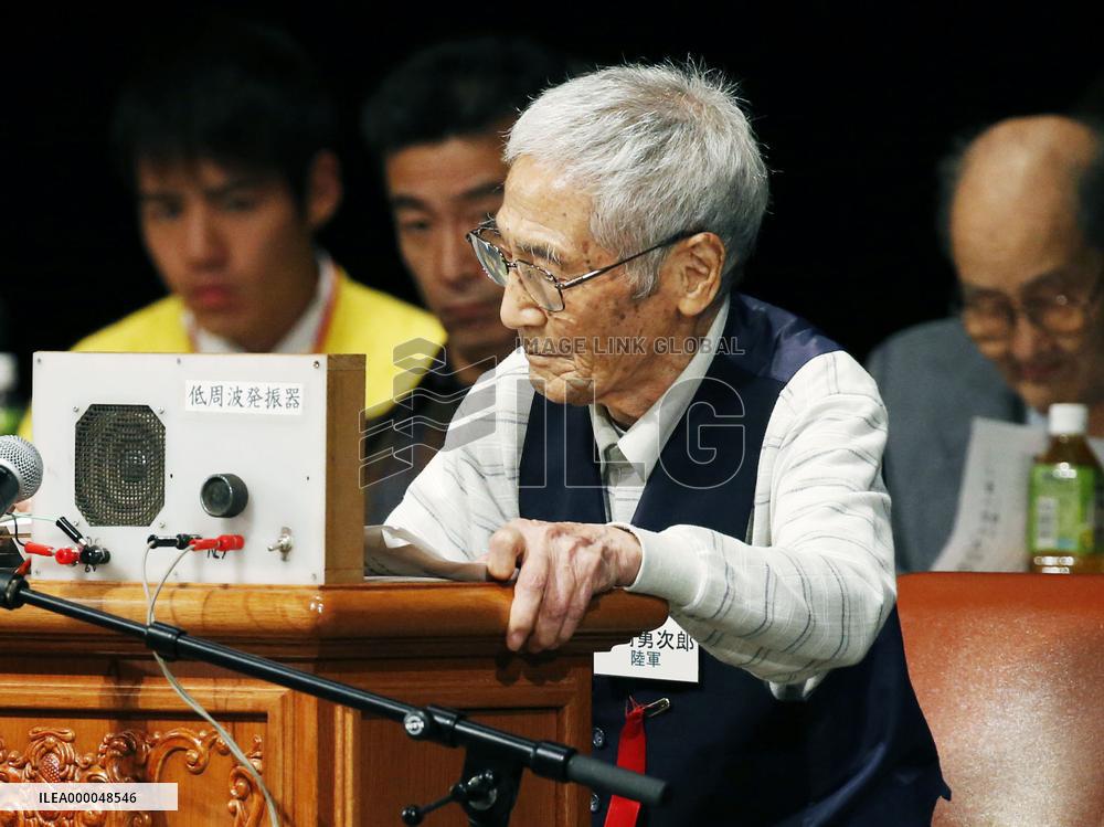 Former Japanese army soldier demonstrates Morse message