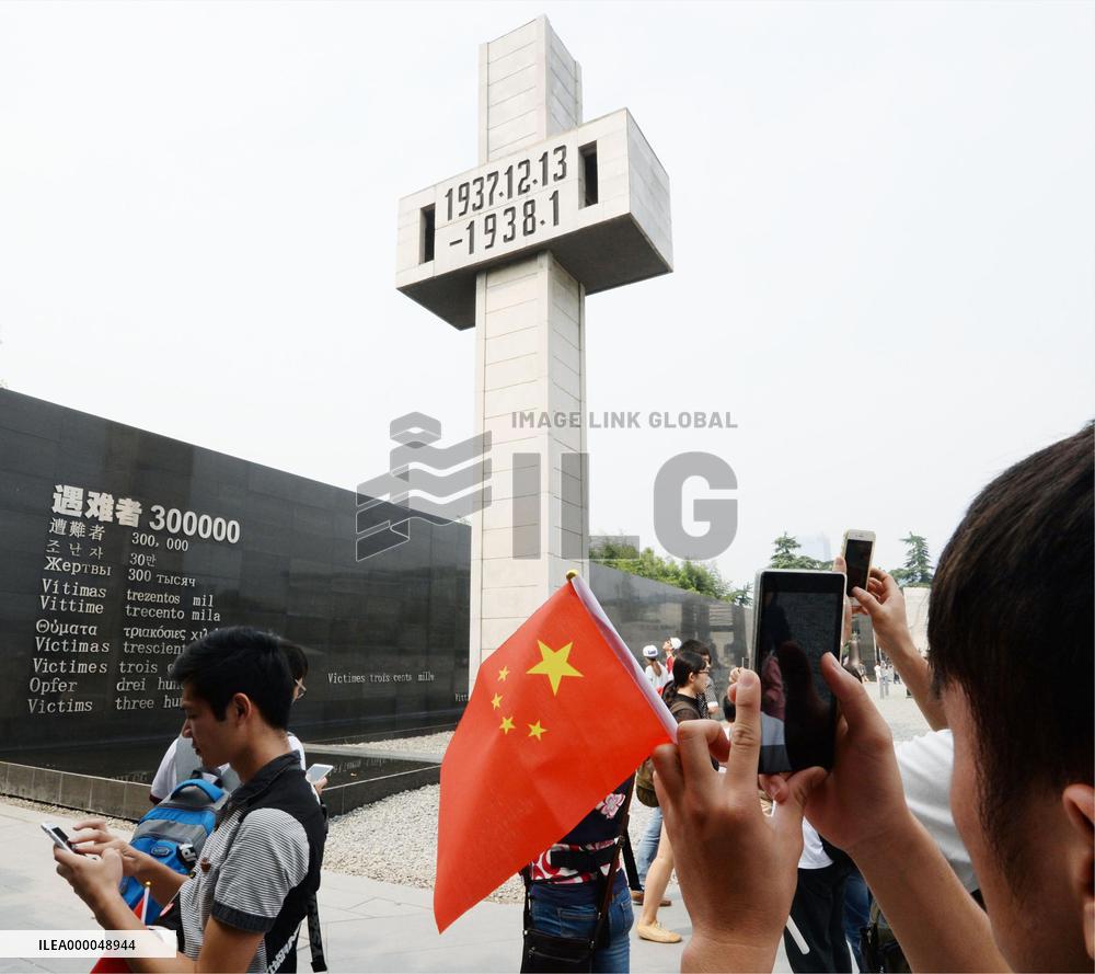 Visitors to Nanjing Massacre Museum take photos
