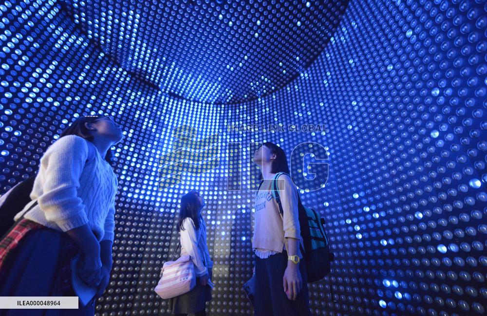 High school students look at Super-Kamiokande model