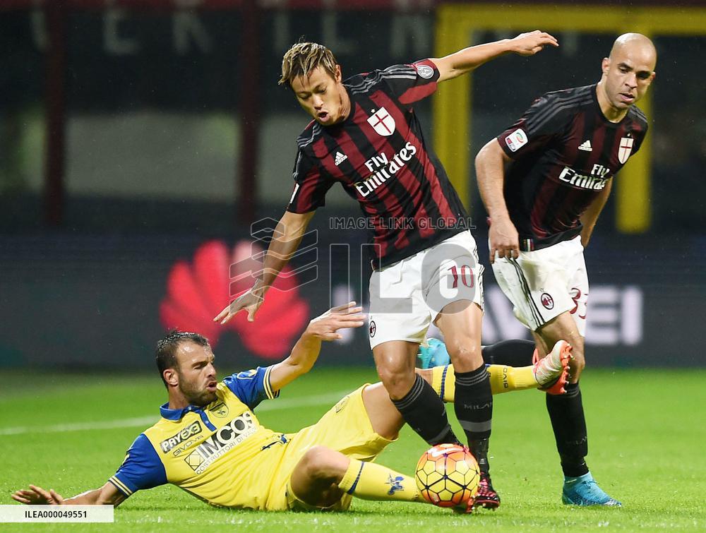 Japanese MF Honda of Milan competes for ball in Chievo match