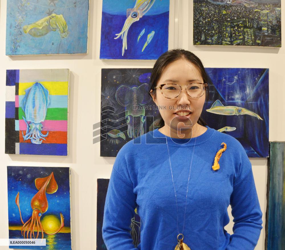 Woman painter specializes in drawing squid