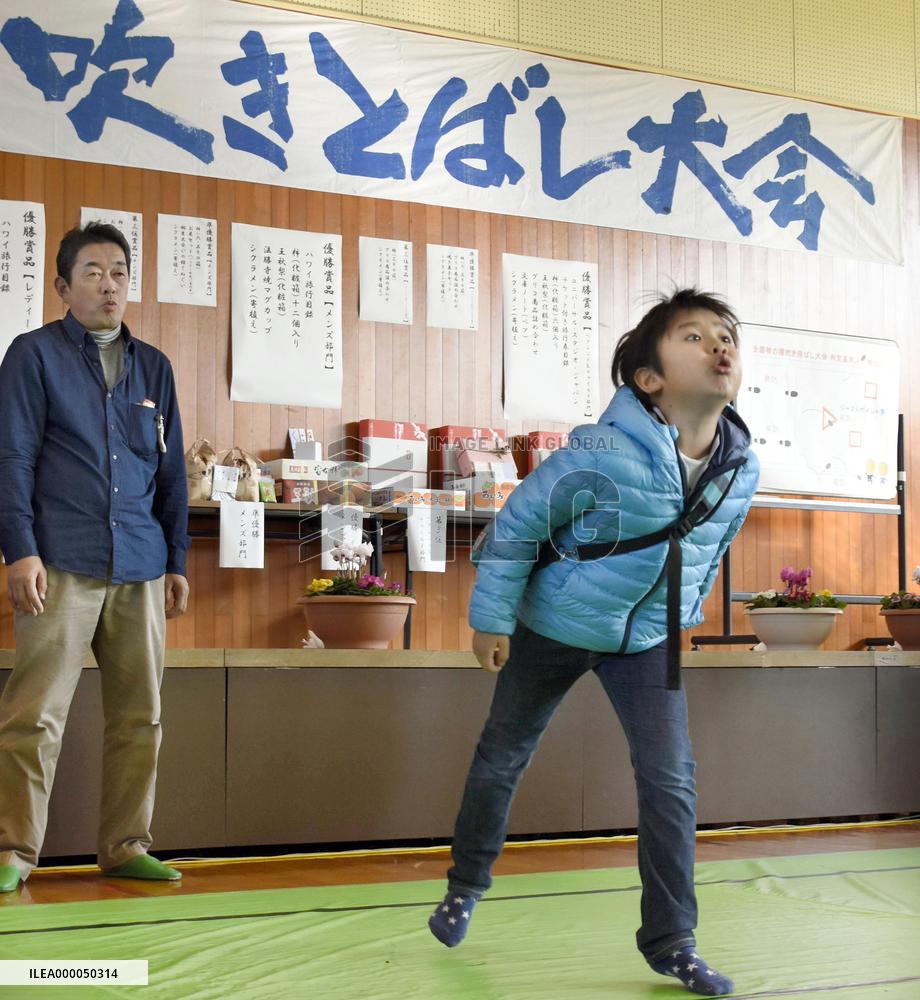 Persimmon seed-spitting contest held in western Japan
